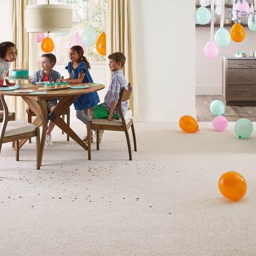 kids playing around table from McMillen's Carpet Outlet in Clarion